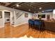 Finished basement featuring a dining area, stairs and laundry room access at 3400 S Ivy Way, Denver, CO 80222