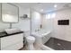 Modern bathroom with a glass-enclosed shower, deep soaking tub, and vessel sink at 3400 S Ivy Way, Denver, CO 80222