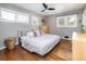 Serene bedroom with hardwood floors, neutral tones, and ample natural light at 3400 S Ivy Way, Denver, CO 80222