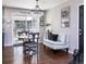 Bright dining area with backyard access and elegant chandelier at 3400 S Ivy Way, Denver, CO 80222