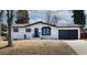 Charming ranch-style home featuring a manicured lawn and an attached two car garage at 3400 S Ivy Way, Denver, CO 80222