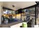 Inviting covered patio with cozy seating, perfect for outdoor relaxation at 3400 S Ivy Way, Denver, CO 80222