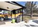 Covered patio featuring comfortable seating and outdoor entertainment options at 3400 S Ivy Way, Denver, CO 80222