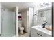 Updated bathroom featuring glass enclosed shower, modern fixtures, and updated vanity at 18874 E Mexico Dr, Aurora, CO 80017