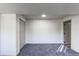 Bedroom featuring neutral colored walls, carpet, closet and natural light at 18874 E Mexico Dr, Aurora, CO 80017