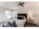 Bright and inviting bedroom with large windows, plush carpeting, and stylish furnishings at 18874 E Mexico Dr, Aurora, CO 80017