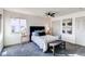 Cozy bedroom with a comfortable bed, stylish decor, and ample natural light at 18874 E Mexico Dr, Aurora, CO 80017