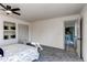 Bedroom featuring a neutral color palette and a view to a kitchen at 18874 E Mexico Dr, Aurora, CO 80017