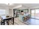 Stylish kitchen featuring stainless steel appliances, a breakfast bar with seating, and a view to the deck at 18874 E Mexico Dr, Aurora, CO 80017