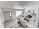 Open floor plan reveals living area with fireplace, large windows, and modern flooring at 18874 E Mexico Dr, Aurora, CO 80017