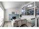 Bright living room with a cozy fireplace and staircase at 18874 E Mexico Dr, Aurora, CO 80017