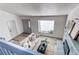 Bright living room featuring a fireplace, large window, and comfortable seating area at 18874 E Mexico Dr, Aurora, CO 80017