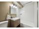 The newly renovated bathroom features a sleek vanity, modern fixtures, and a shower at 75 N Emerson St # 104, Denver, CO 80218