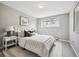 Relax in this bedroom with a plush bed, soft rug, and a bright window at 75 N Emerson St # 104, Denver, CO 80218