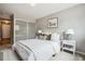 This cozy bedroom features a plush bed and abundant natural light at 75 N Emerson St # 104, Denver, CO 80218