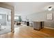 Open floor plan with hardwood floors with view into the living room and dining area at 75 N Emerson St # 104, Denver, CO 80218