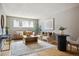 Bright living room with hardwood floors, contemporary decor, and natural light at 75 N Emerson St # 104, Denver, CO 80218