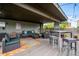 Comfortable rooftop deck featuring lounge seating, tables, and a colorful outdoor rug at 75 N Emerson St # 104, Denver, CO 80218
