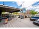 Spacious rooftop deck with ample seating areas, string lights, and city views at 75 N Emerson St # 104, Denver, CO 80218
