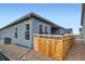 Exterior view showing the fenced backyard, and modern gray siding of the property at 1871 Grayside Cir, Castle Rock, CO 80109
