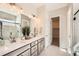 Elegant bathroom featuring double vanity, marble countertop, and glass enclosed shower at 1871 Grayside Cir, Castle Rock, CO 80109