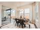 Bright dining room featuring modern chandelier and sliding glass door to outdoor patio at 1871 Grayside Cir, Castle Rock, CO 80109