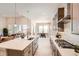 Bright kitchen with an island, modern appliances and cabinetry, view to dining and living spaces at 1871 Grayside Cir, Castle Rock, CO 80109
