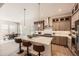Spacious kitchen features a large island, stainless appliances, and ample cabinet space, open concept at 1871 Grayside Cir, Castle Rock, CO 80109