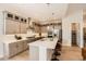 Bright kitchen features modern cabinetry, stainless steel appliances, and a large center island with bar seating at 1871 Grayside Cir, Castle Rock, CO 80109