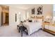 Tranquil main bedroom showcasing woven headboard, soft textures and a view to the bathroom at 1871 Grayside Cir, Castle Rock, CO 80109