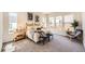 Bright main bedroom with three large windows, woven headboard, and soft textures at 1871 Grayside Cir, Castle Rock, CO 80109
