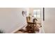 Cozy home office with wood desk, cowhide rug, ladder, and natural light at 1871 Grayside Cir, Castle Rock, CO 80109