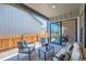 Relaxing outdoor patio features stylish furniture, privacy fence, and seamless transition to indoor dining at 1871 Grayside Cir, Castle Rock, CO 80109
