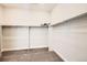 Spacious walk-in closet with neutral carpeting and ample shelving at 1871 Grayside Cir, Castle Rock, CO 80109