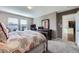 Comfortable bedroom featuring a large bed, ample natural light, and neutral décor at 5280 Raritan Way, Denver, CO 80221