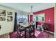 Bright dining area featuring natural light, elegant curtains, and views of the backyard, ideal for Gathering meals and gatherings at 5280 Raritan Way, Denver, CO 80221