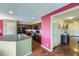 Well-lit kitchen with wooden floors, granite countertops, dark cabinets, and black appliances, providing a modern and functional space at 5280 Raritan Way, Denver, CO 80221
