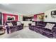 Spacious living area featuring a connecting kitchen, dining area, and comfortable seating, perfect for relaxation and social gatherings at 5280 Raritan Way, Denver, CO 80221