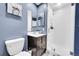 Modern bathroom with a walk-in shower, vanity and a painting of a turtle on the wall at 4146 S Mobile Cir # A, Aurora, CO 80013