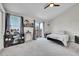 Spacious bedroom with vaulted ceiling, carpeted floors, and a sliding glass door to a balcony at 4146 S Mobile Cir # A, Aurora, CO 80013