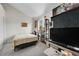 Inviting bedroom featuring a bed and gaming and entertainment setup at 4146 S Mobile Cir # A, Aurora, CO 80013