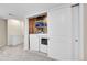 A functional laundry room with white washer, dryer, and shelving at 4146 S Mobile Cir # A, Aurora, CO 80013