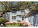 Two-story home's backyard featuring a patio, grill, and mature tree at 7382 E 8Th Pl, Denver, CO 80230