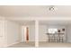 Finished basement featuring a wet bar, theatre projection mount, and column at 7382 E 8Th Pl, Denver, CO 80230