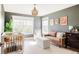 Cozy Bedroom with a crib, a leather sofa, large windows, and stylish decor, great for a young Gathering at 7382 E 8Th Pl, Denver, CO 80230