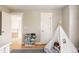 Bright bedroom with hardwood floors, white door, teepee and reading book stand at 7382 E 8Th Pl, Denver, CO 80230