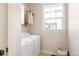 Bright laundry room featuring a modern washer and dryer at 7382 E 8Th Pl, Denver, CO 80230