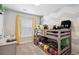 Bedroom featuring a bunk bed and a bright window, creating a cozy and functional space at 9066 Apache Plume Dr # E, Parker, CO 80134