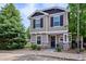 Attractive two-story home with stone accents, dark shutters, and a well-maintained front yard at 9066 Apache Plume Dr # E, Parker, CO 80134