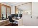 Office space with white desk, multiple monitors, and hardwood floors at 9066 Apache Plume Dr # E, Parker, CO 80134